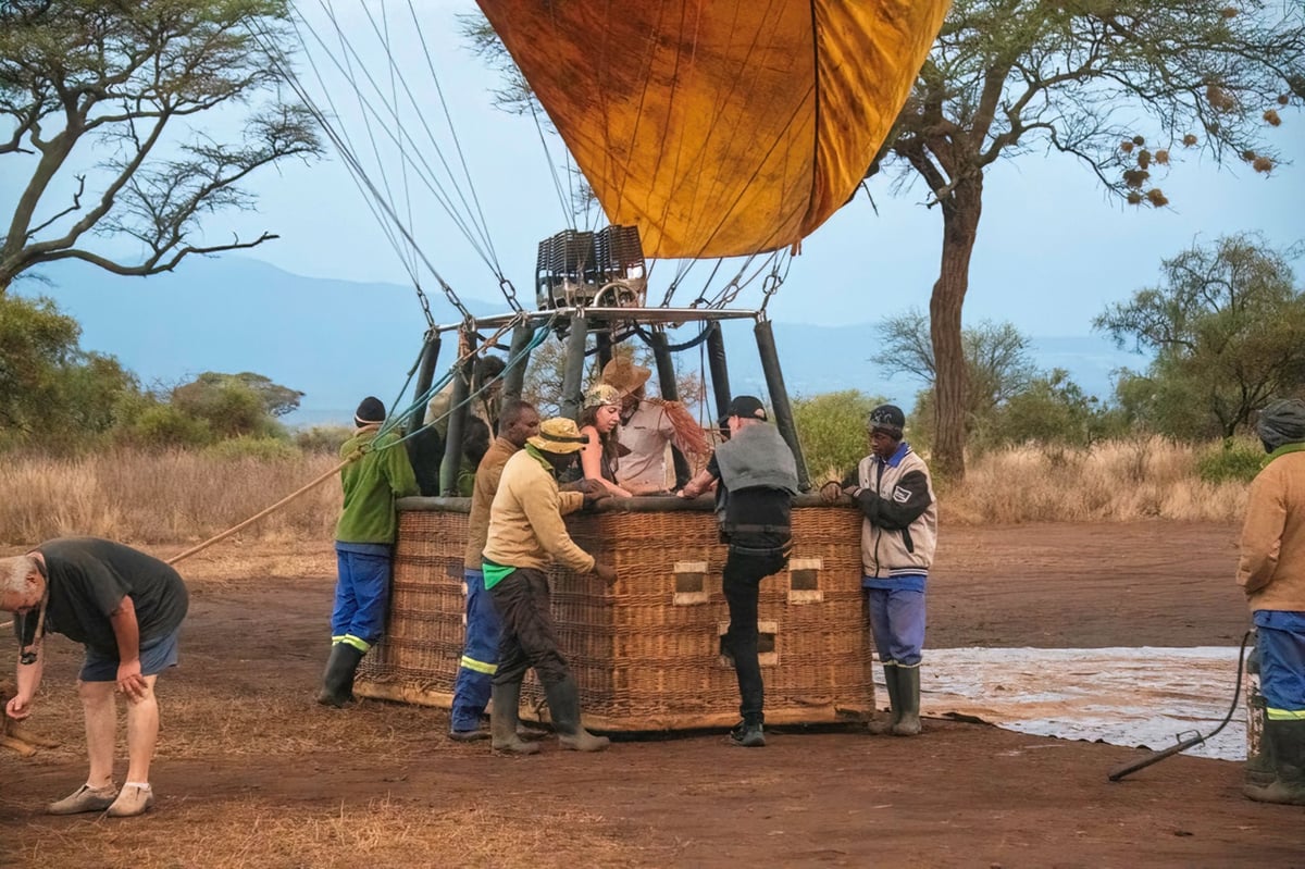 Passengers boarding a hot air balloon basket at Amboseli National Park
